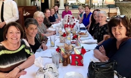 Chris Senseney attending a 2019 Reunion dinner with sisters from Phi Sigma Sigma and Delta Rho